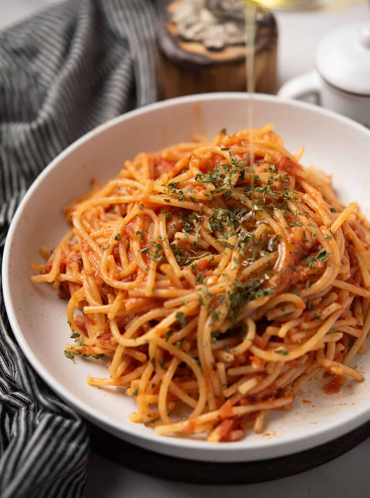 Plate of spicy spaghetti with a rich tomato sauce.