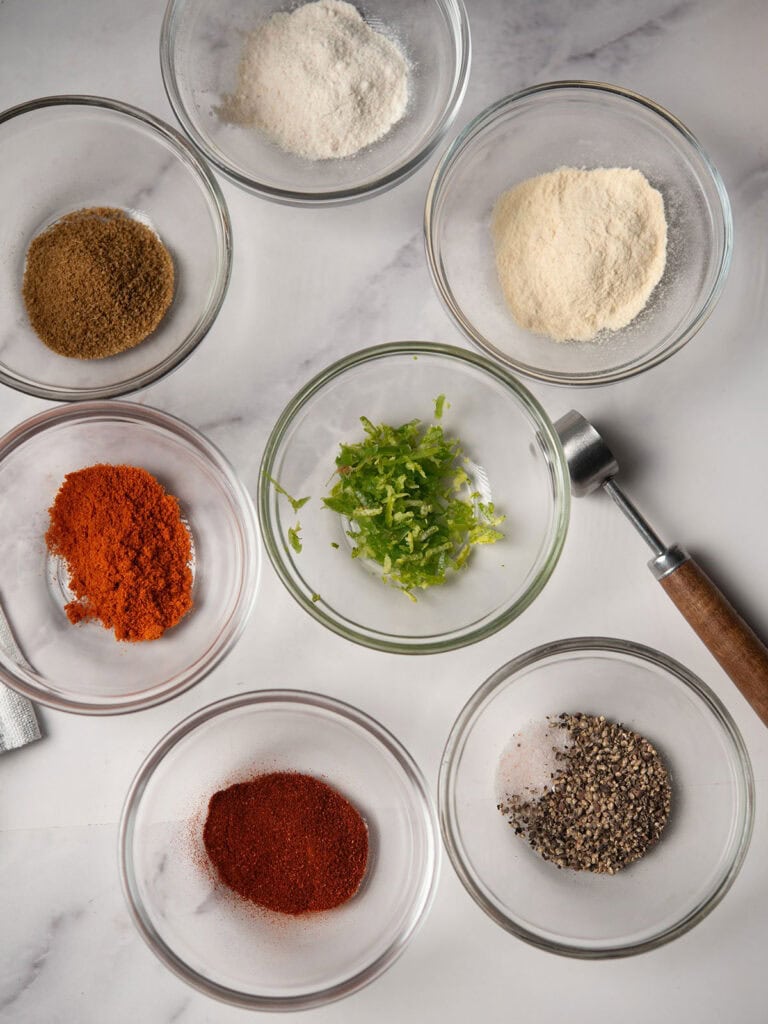 "Ingredients for Chili Aioli: mayonnaise, garlic, lemon juice, chili powder, hot sauce, and seasonings.