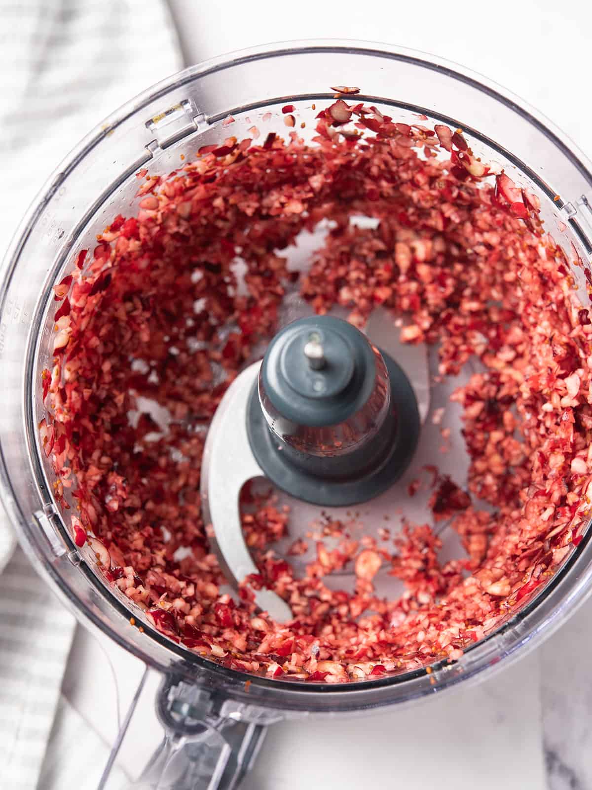 crushing cranberry in the food processor