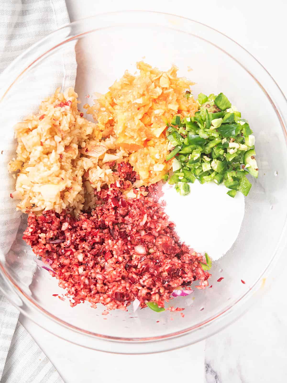 adding all the incredients with chopped jalapeno and cranberry