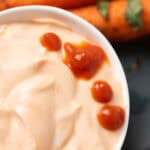 Easy Greek yogurt Sriracha sauce served in a white bowl