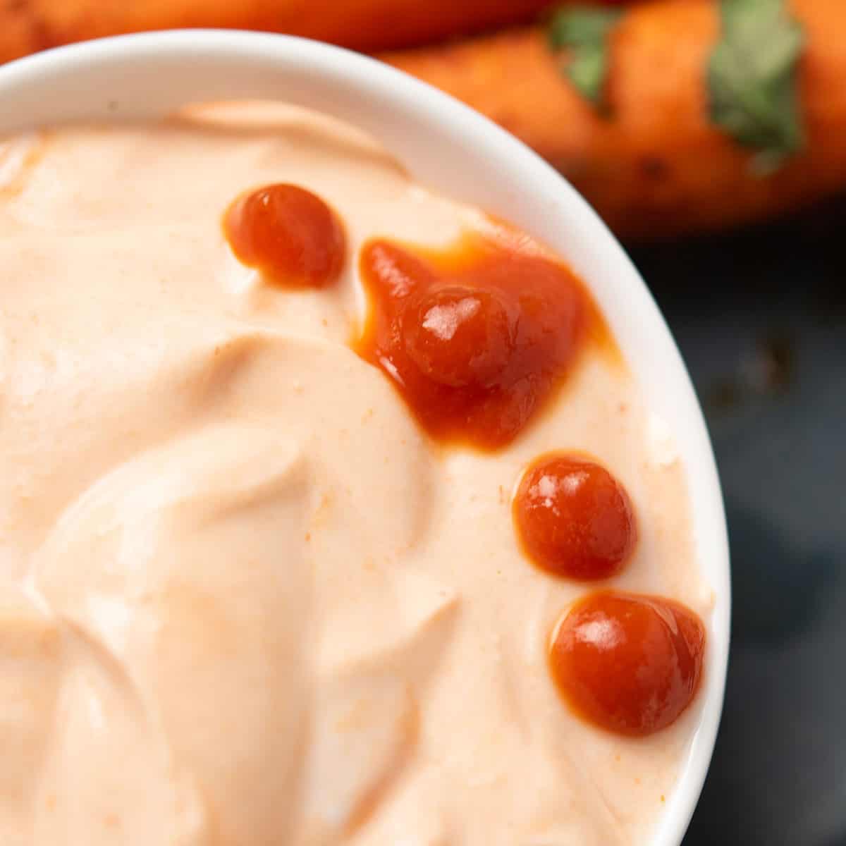 Easy Greek yogurt Sriracha sauce served in a white bowl