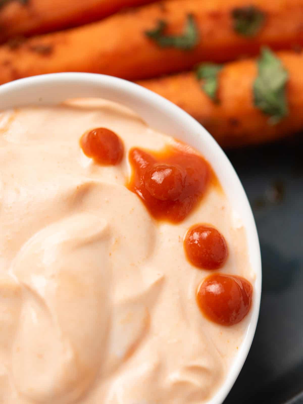 Greek yogurt Sriracha sauce served with crispy French fries.