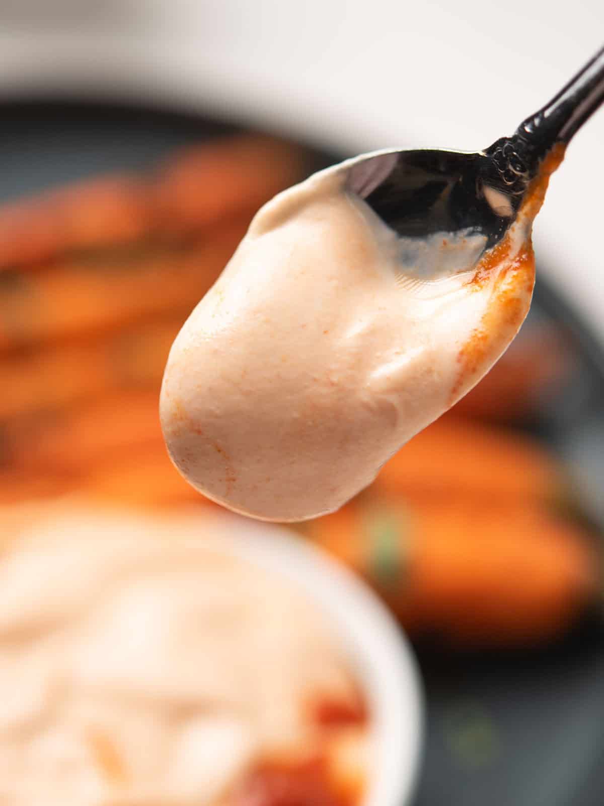 Chilled Greek yogurt Sriracha sauce ready to serve.