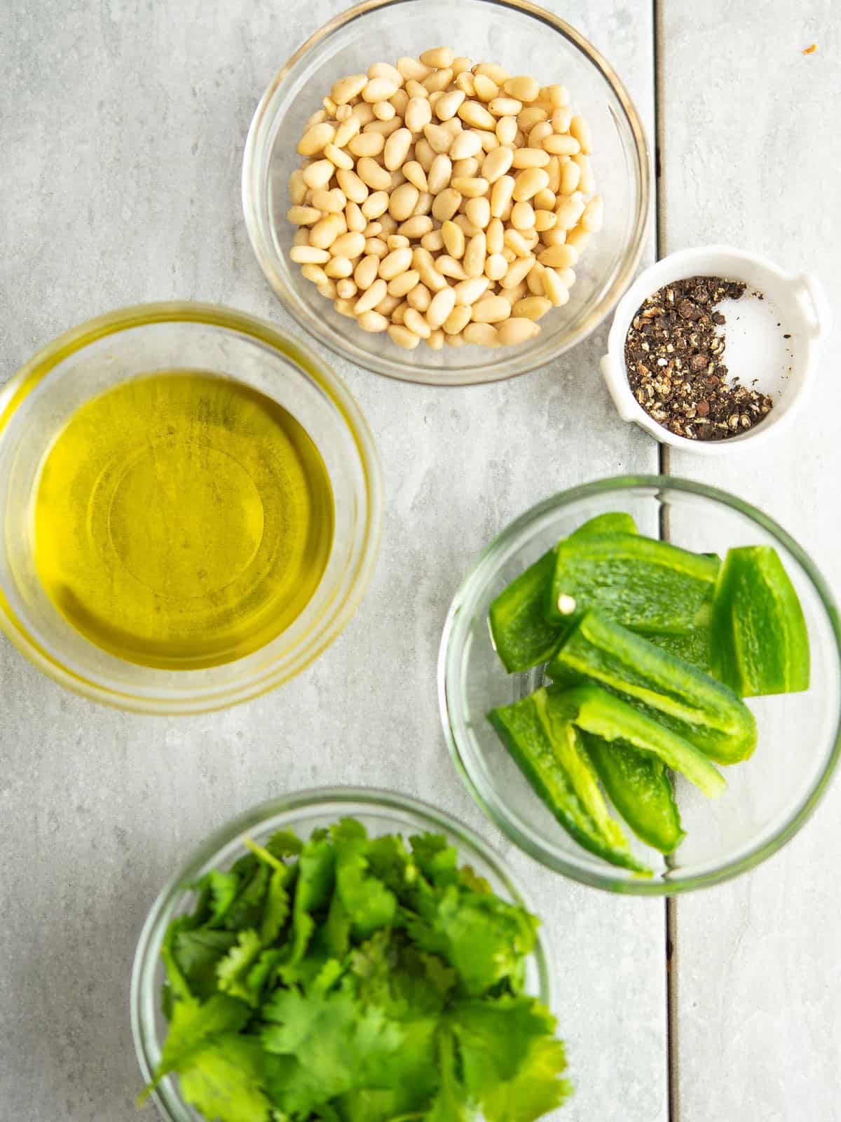 Fresh jalapeno, cilantro, pine nuts, and garlic ready for pesto