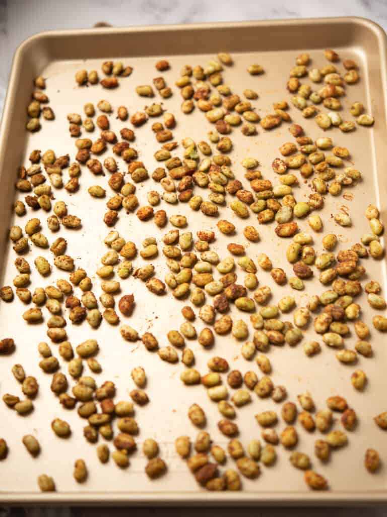 Roasting lima beans in the oven until golden and crispy.