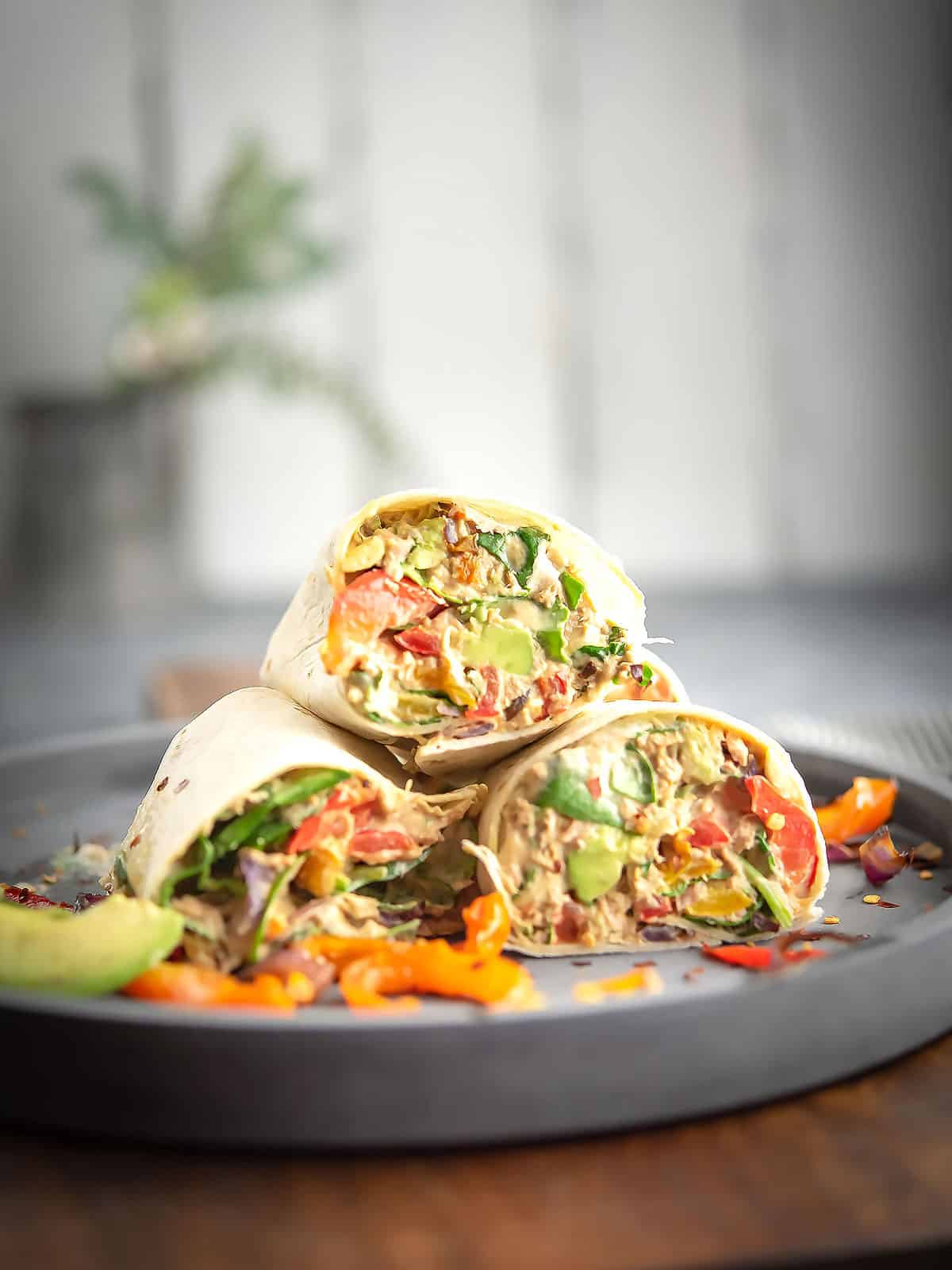 Wrapped spicy tuna filling in a tortilla assembled in the plate