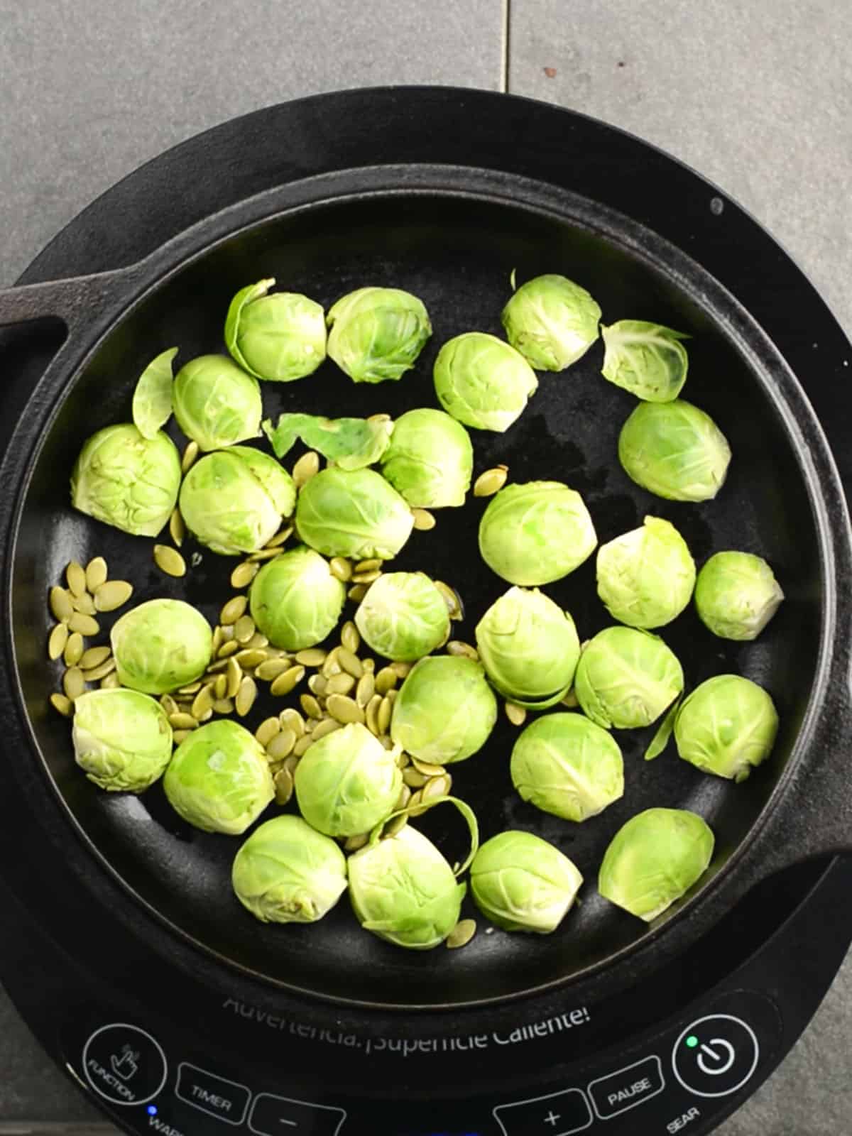 Brussels sprout are added to the pan