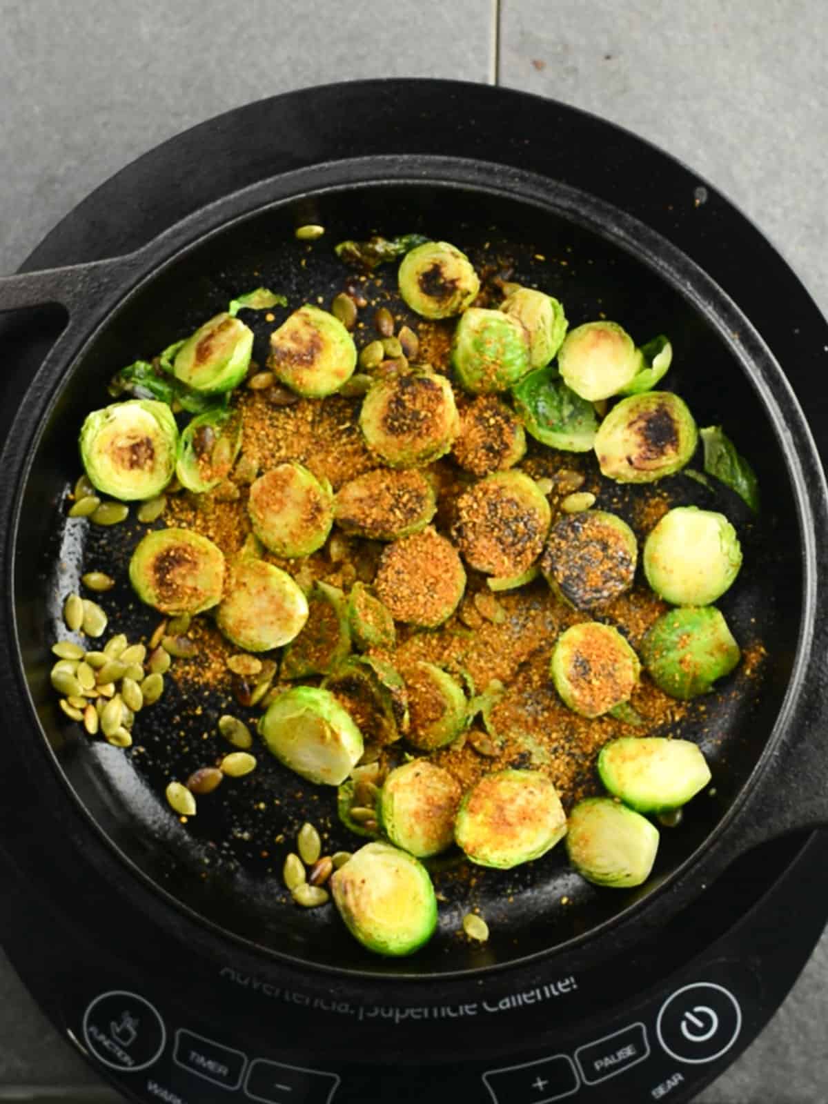 curry powder added to make Indian Brussels sprout in the pan