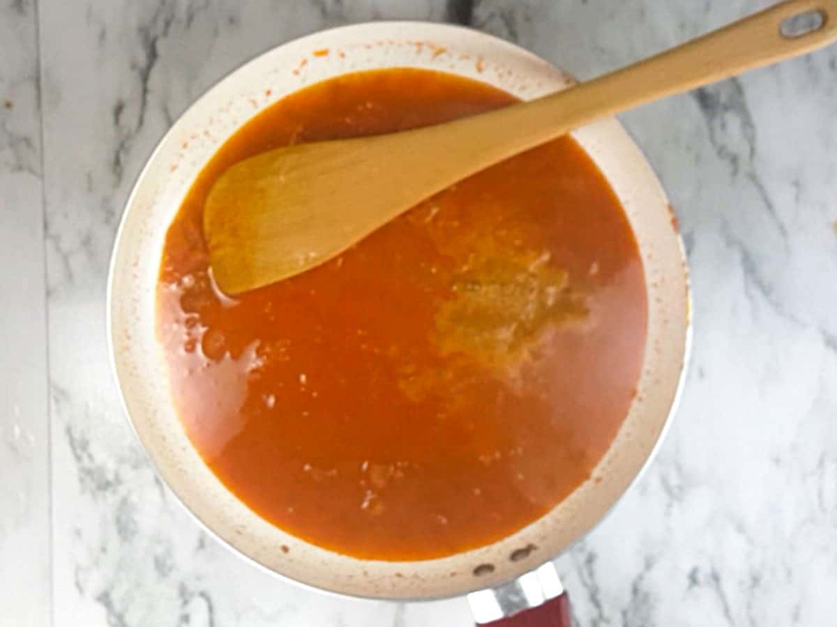 making the curry with onion and tomato