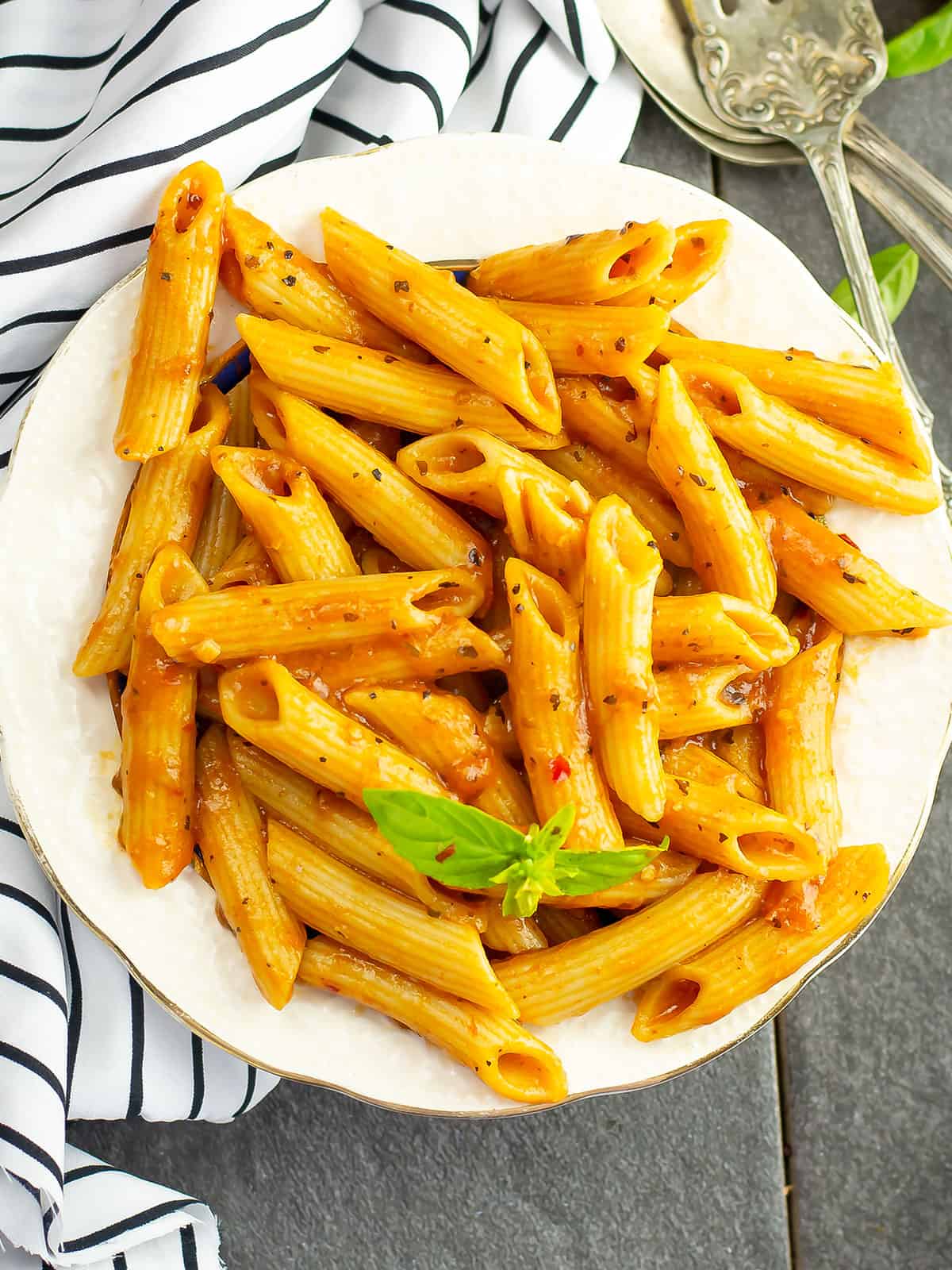 Delicious Instant Pot penne pasta served with fresh basil garnish