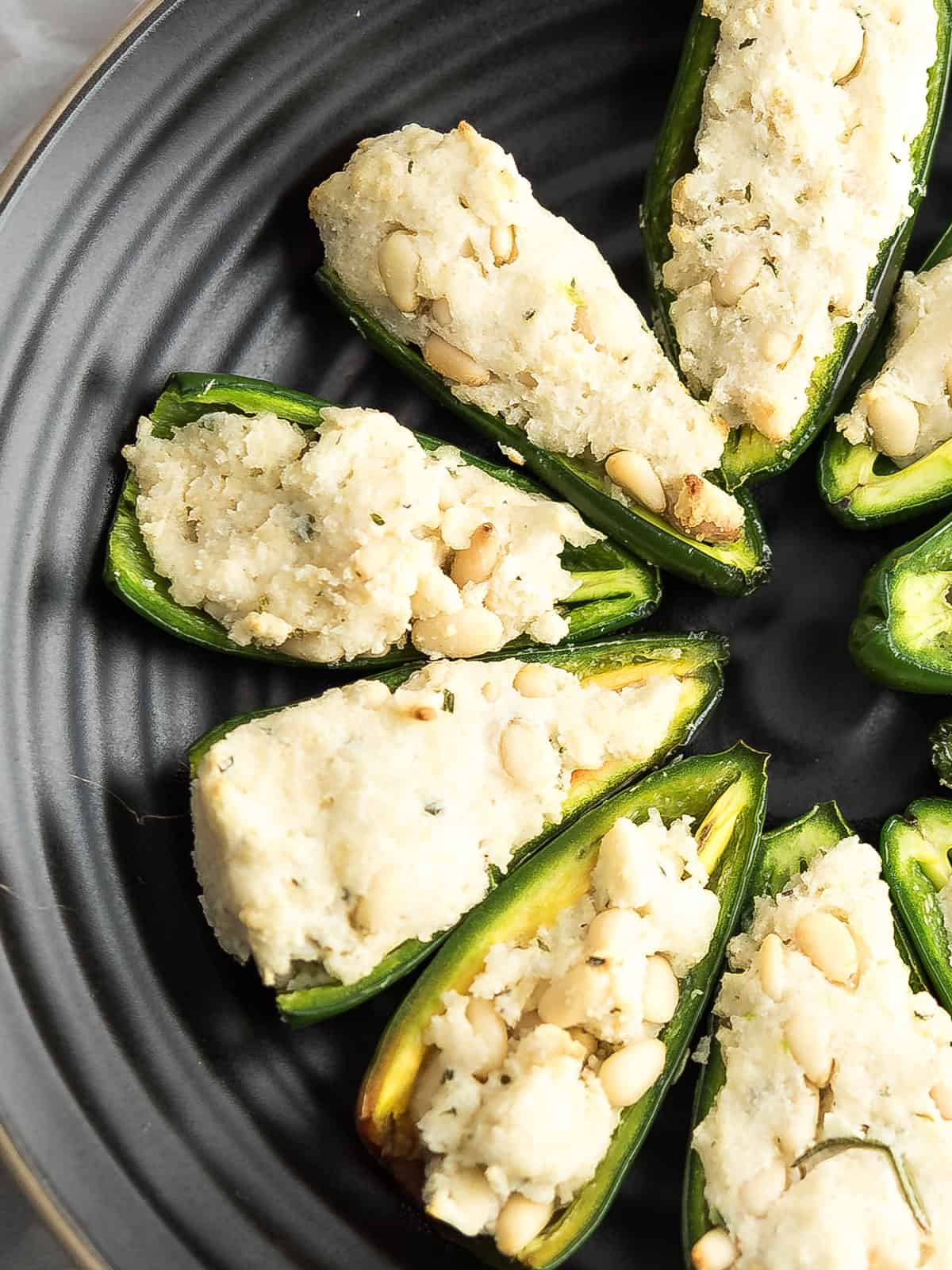 the close view of the jalapeno poppers without cream cheese with visible pine nuts