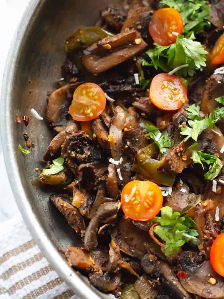 mushroom pepper fry garnished with cilantro leaves ready to serve
