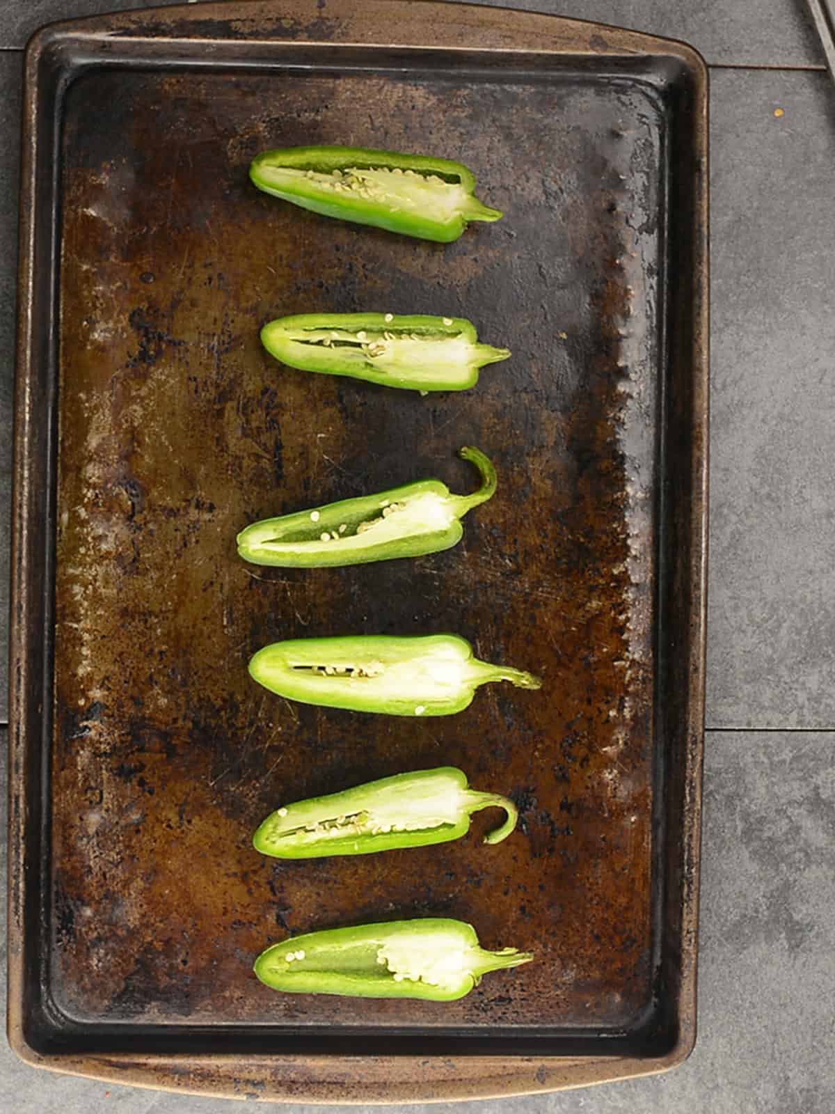 peppers are sliced and arranged in a tray