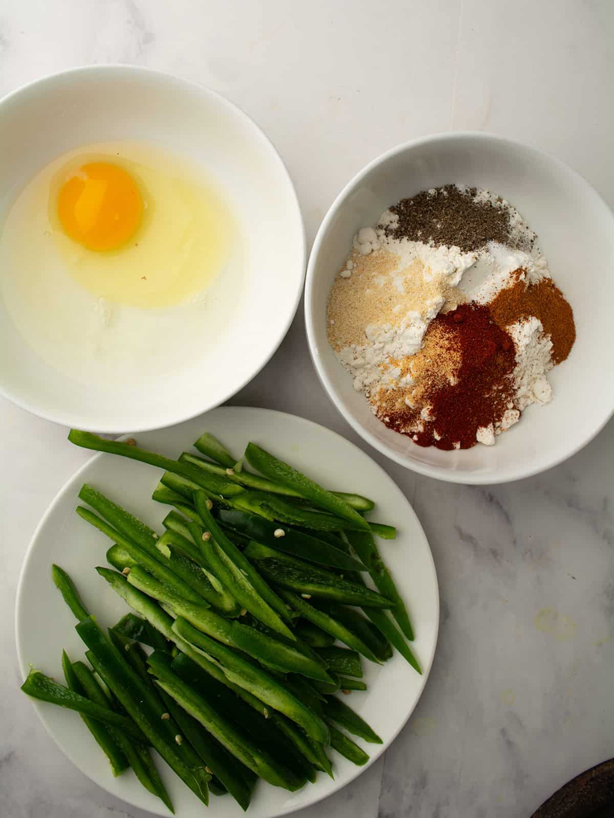 the ingredients are ready in three bowl for dipping