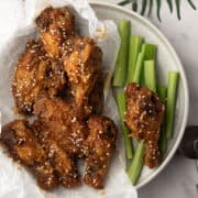 Crispy air-fried Soy Garlic Chicken Wings coated in a tangy, garlicky sauce.