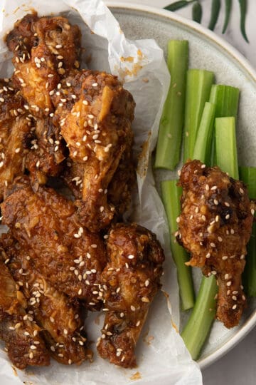 Crispy air-fried Soy Garlic Chicken Wings coated in a tangy, garlicky sauce.