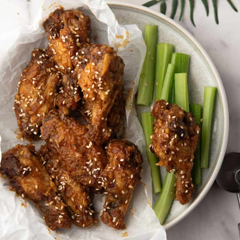 Crispy air-fried Soy Garlic Chicken Wings coated in a tangy, garlicky sauce.