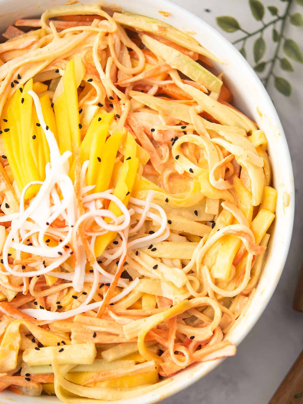 Close-up of Spicy Kani Salad showcasing shredded kani and veggies.