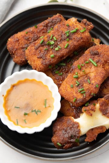 Nashville Hot Mozzarella Sticks served with the dipping sauce for the family or the party