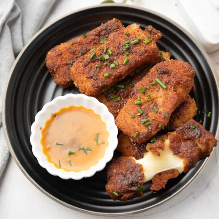Nashville Hot Mozzarella Sticks served with the dipping sauce for the family or the party