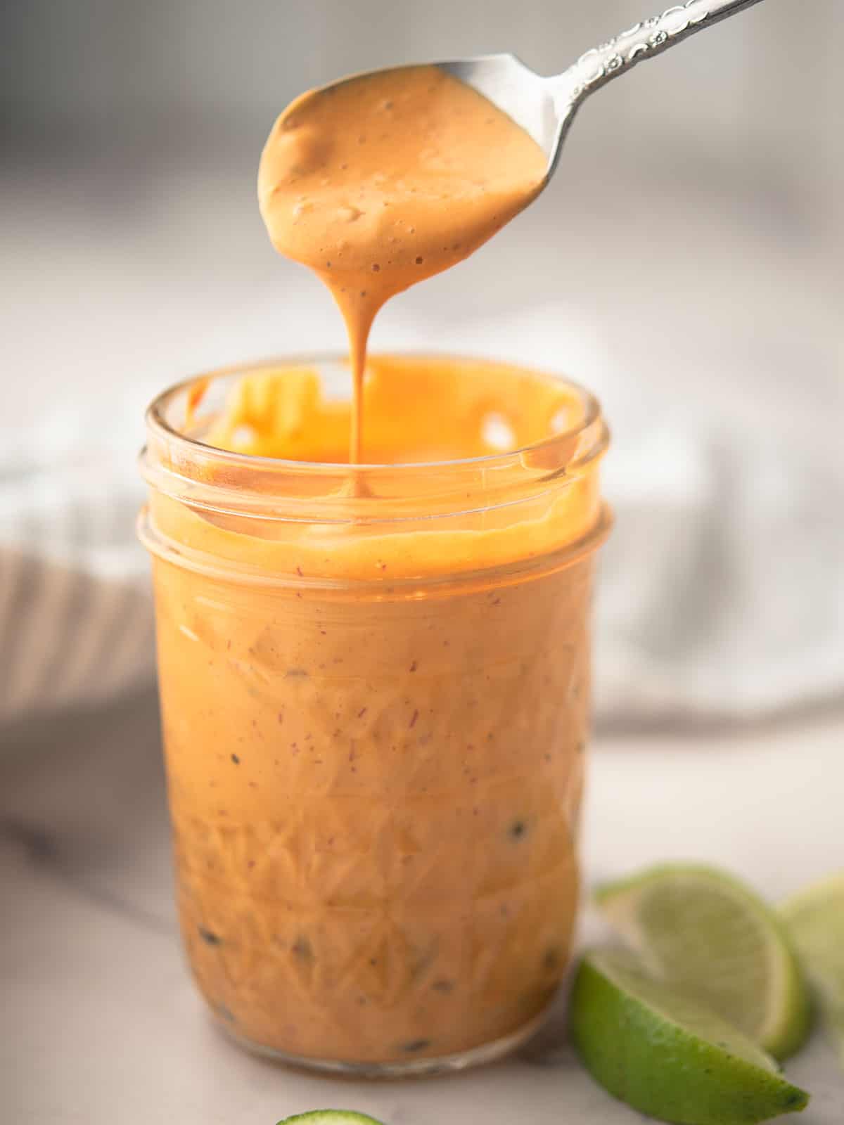 Creamy Chipotle Lime Sauce drizzled over freshly grilled tacos.