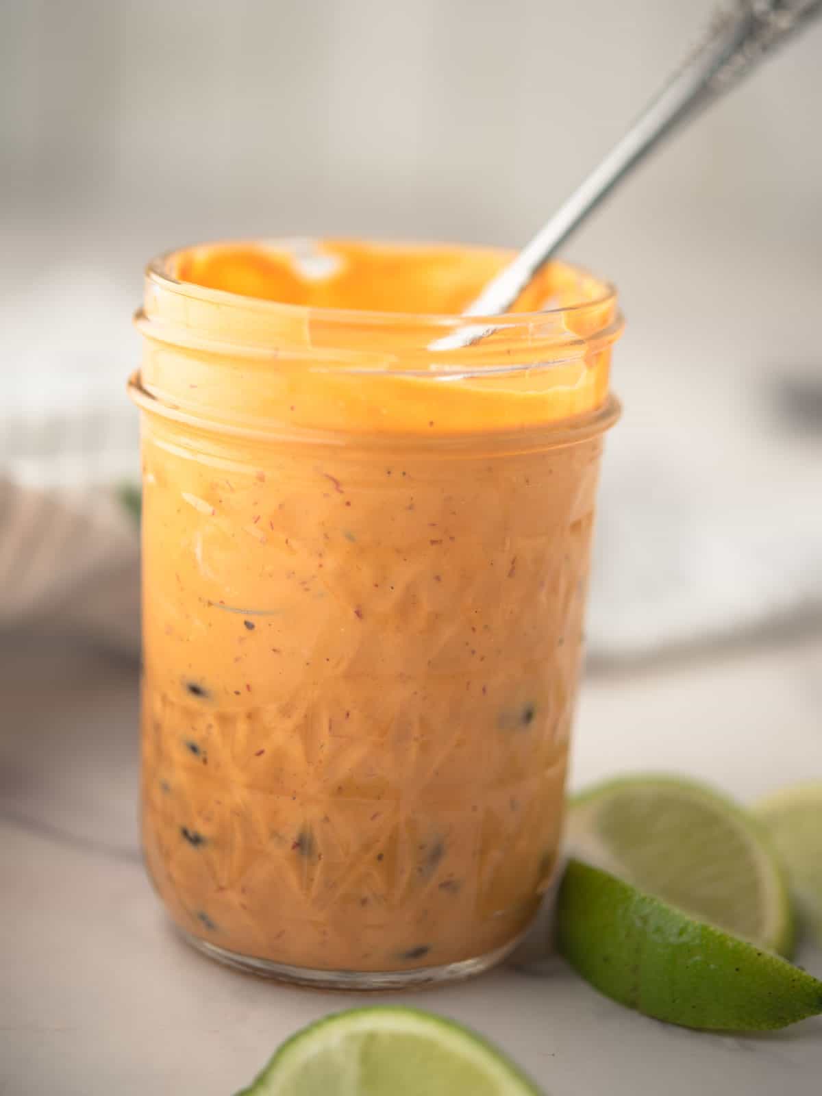 Mixing ingredients in a blender to create a smooth Chipotle Lime Sauce