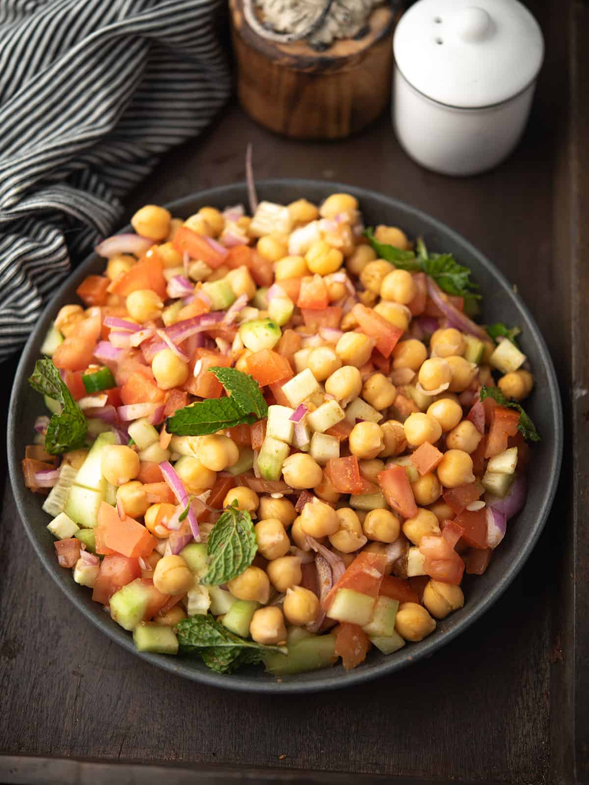 Colorful Indian chickpea salad with fresh vegetables in a bowl