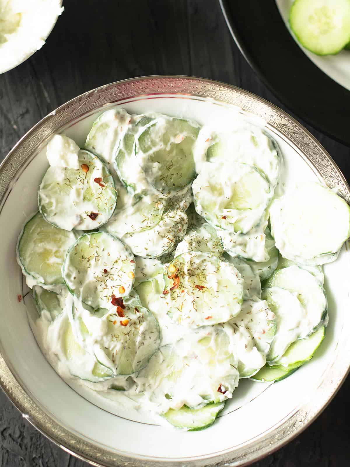 greek yogurt cucumber salad in the bowl garnished with dill