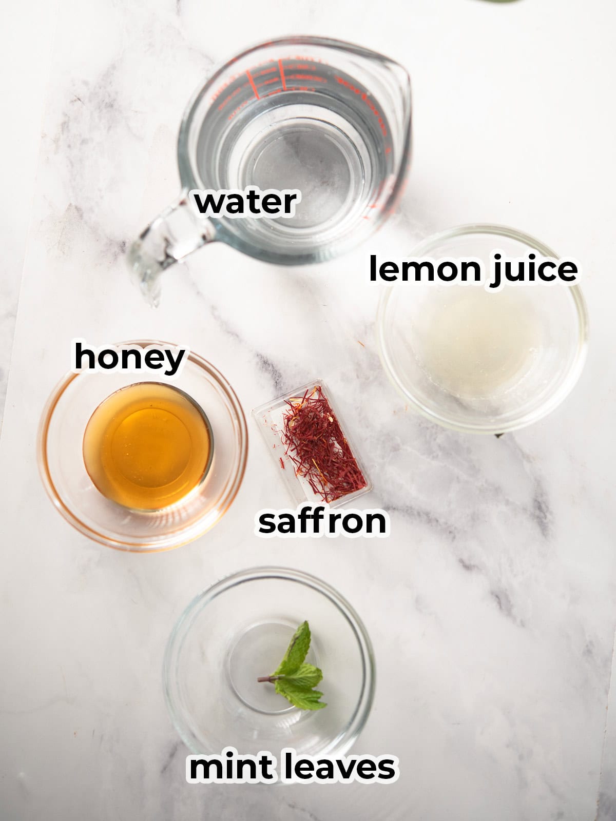 ingredients for the saffron tea assembled in the kitchen counter