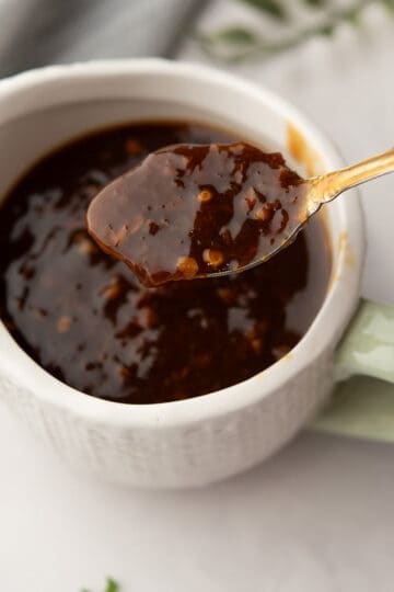 orange ginger sauce in a bowl is ready to serve with grilled chicken