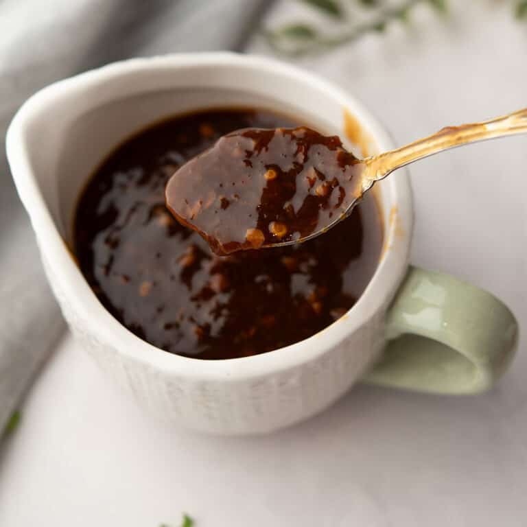 orange ginger sauce in a bowl is ready to serve with grilled chicken