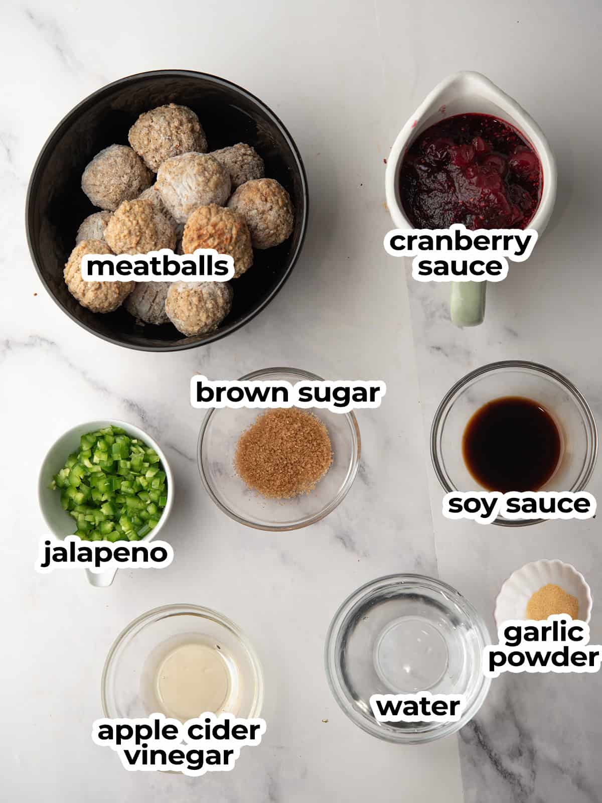Ingredients for Jalapeño Cranberry Meatballs: meatballs, cranberry sauce, jalapeño, soy sauce, vinegar, brown sugar, and water.