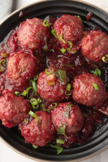 jalapeno cranberry sauce served in a plate with a spoon