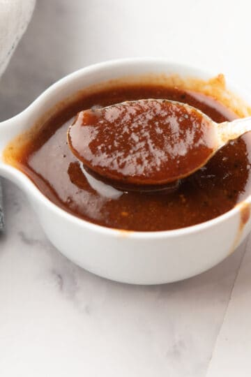 pineapple bbq sauce in a pan with a spoon