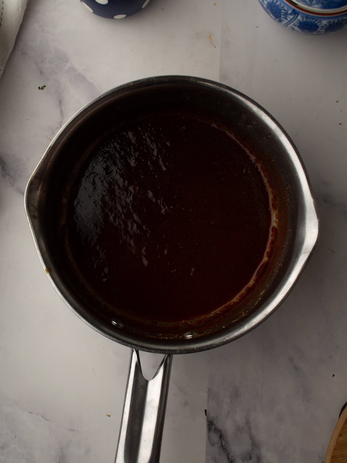thicken Pineapple BBQ Sauce cooling in the pan