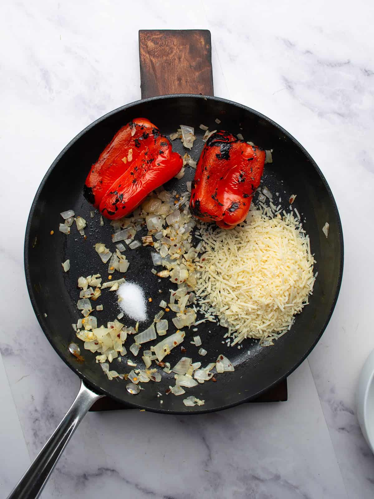 sauteed onion, bell peppers, cheese and other spices ready for making the sauce.