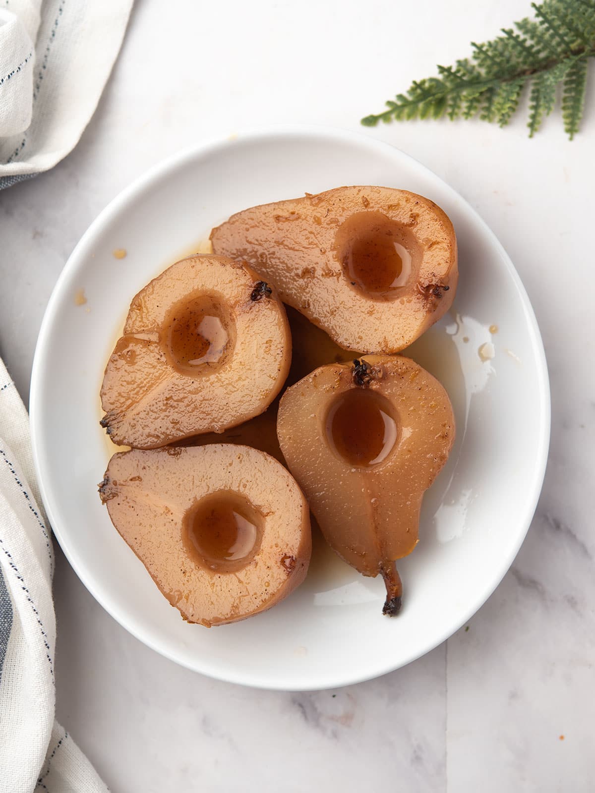Delicious spiced pears in syrup topped with spices and zest.