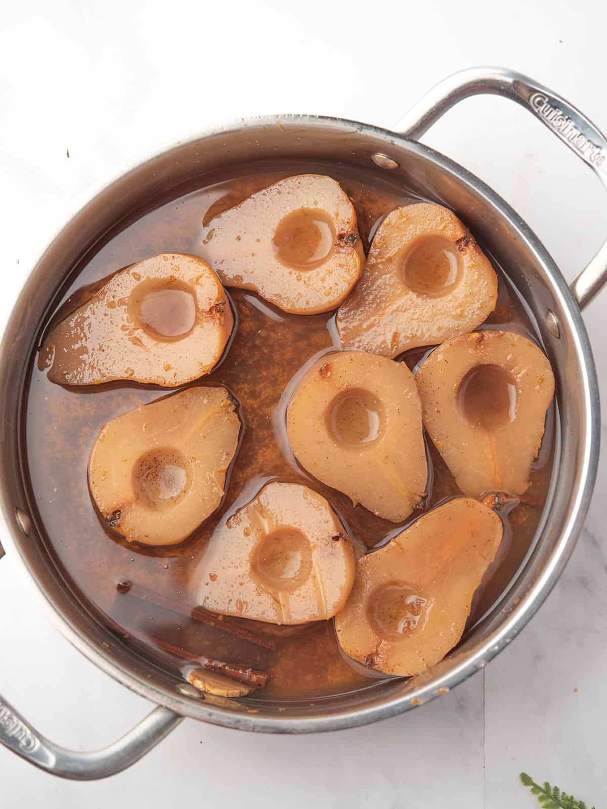Thickening syrup in a saucepan, ready to drizzle over pears.