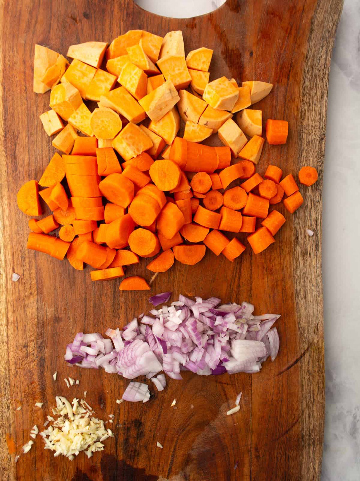 veggies are chopped and placed in the cutting board