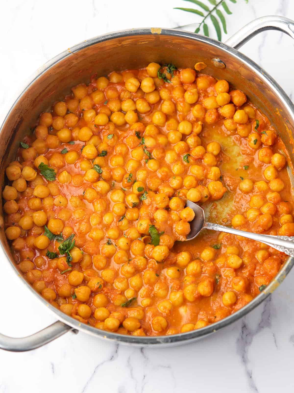chickpea curry without coconut milk made in a pan, ready to serve