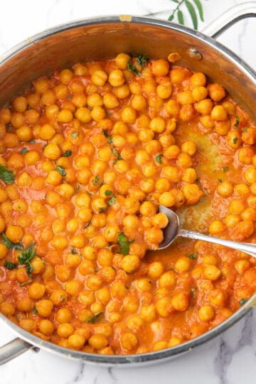 chickpea curry without coconut milk garnished with cilantro