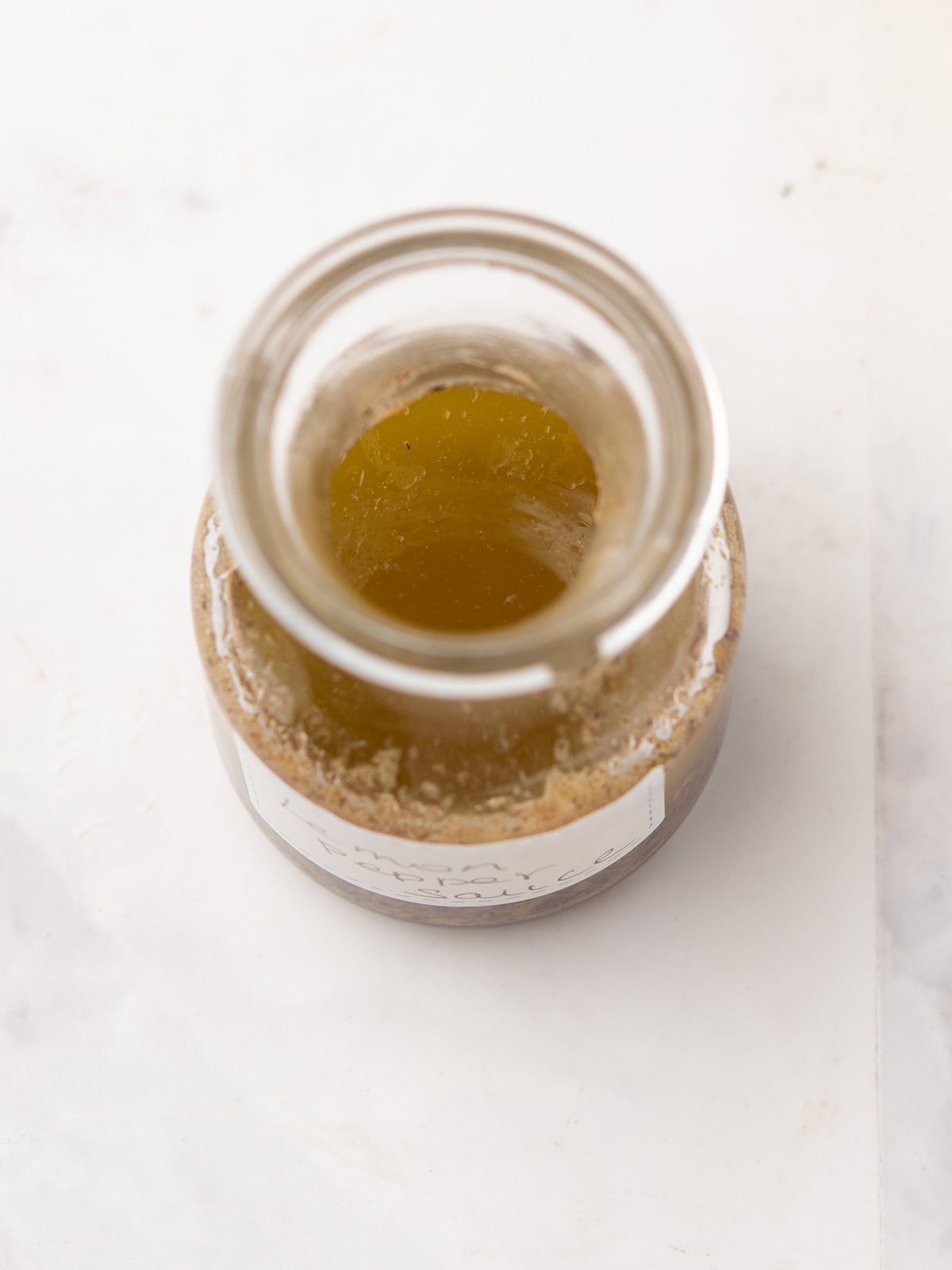 lemon pepper sauce in a clear glass jar