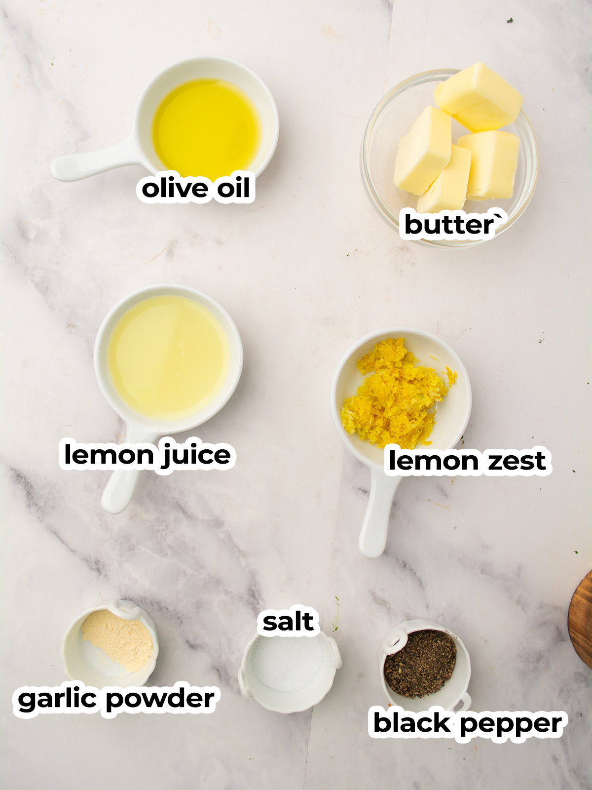 Ingredients for lemon pepper sauce: butter, olive oil, lemon, black pepper, garlic powder.