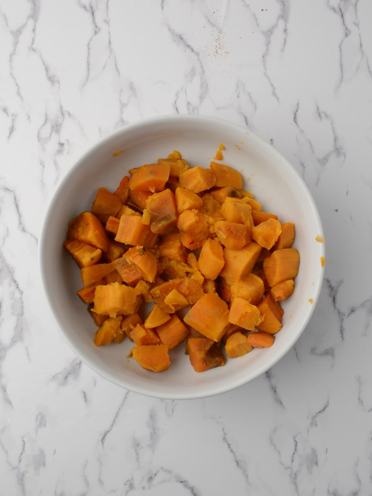 sweet potatoes added to the mixing bowl