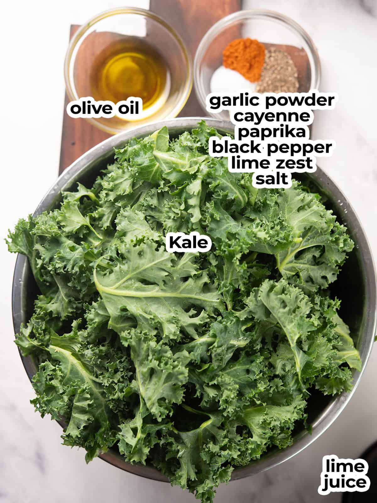 ingredients for the spicy kale chips arranged over the counter top.