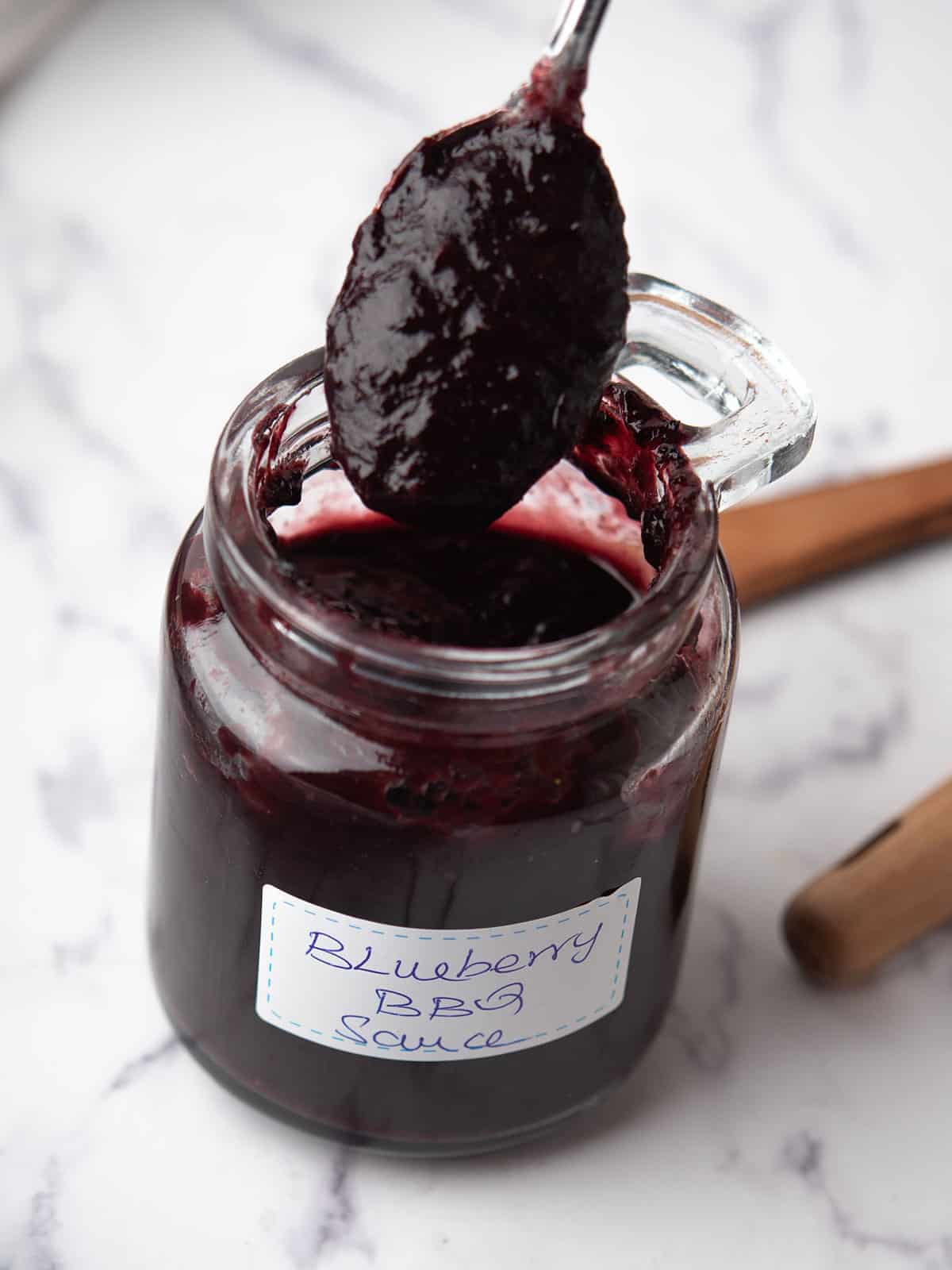 blueberry bbq sauce ready to drizzle over the chicken