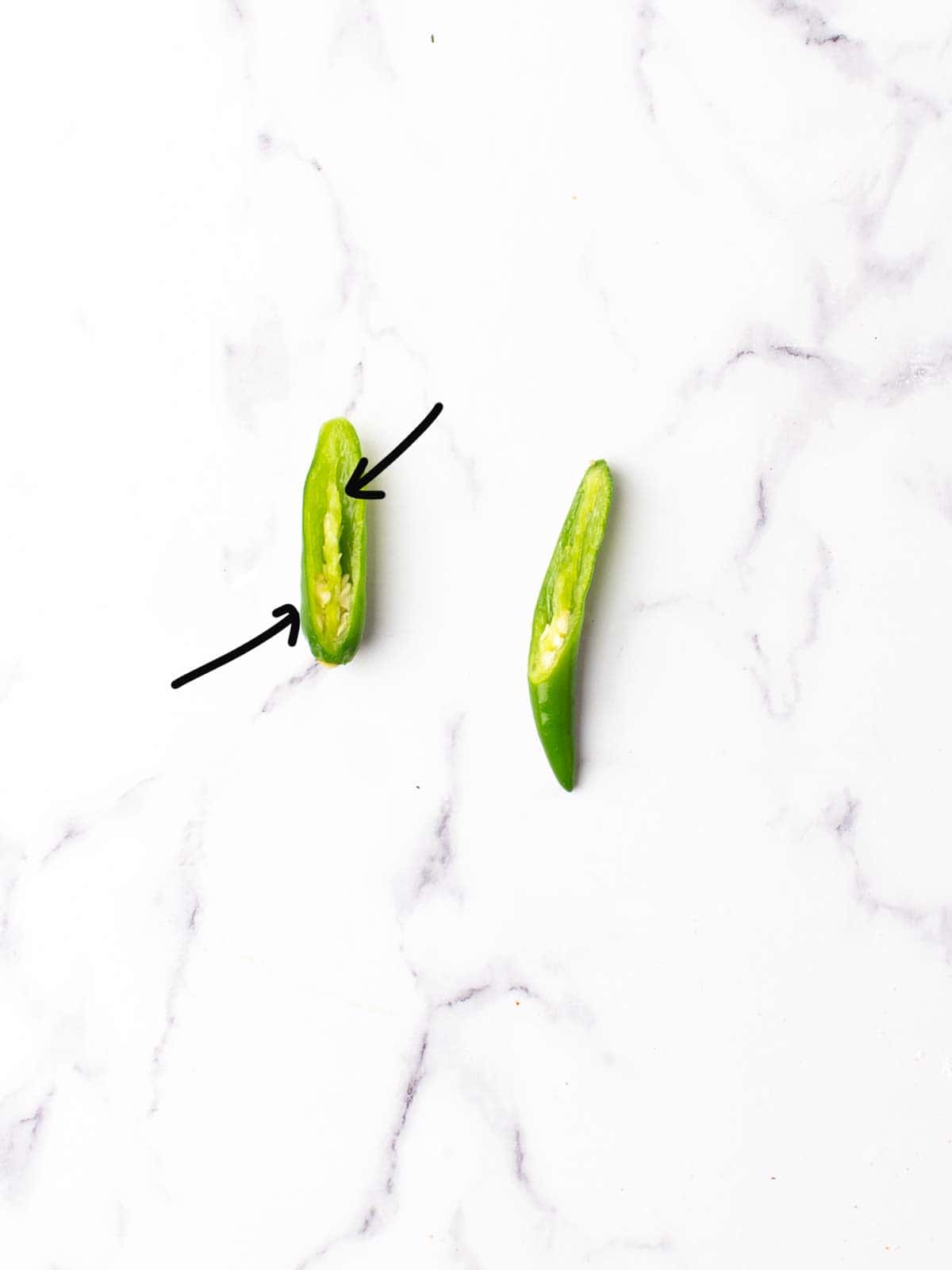 remove the seeds and the pith of the serrano peppers.