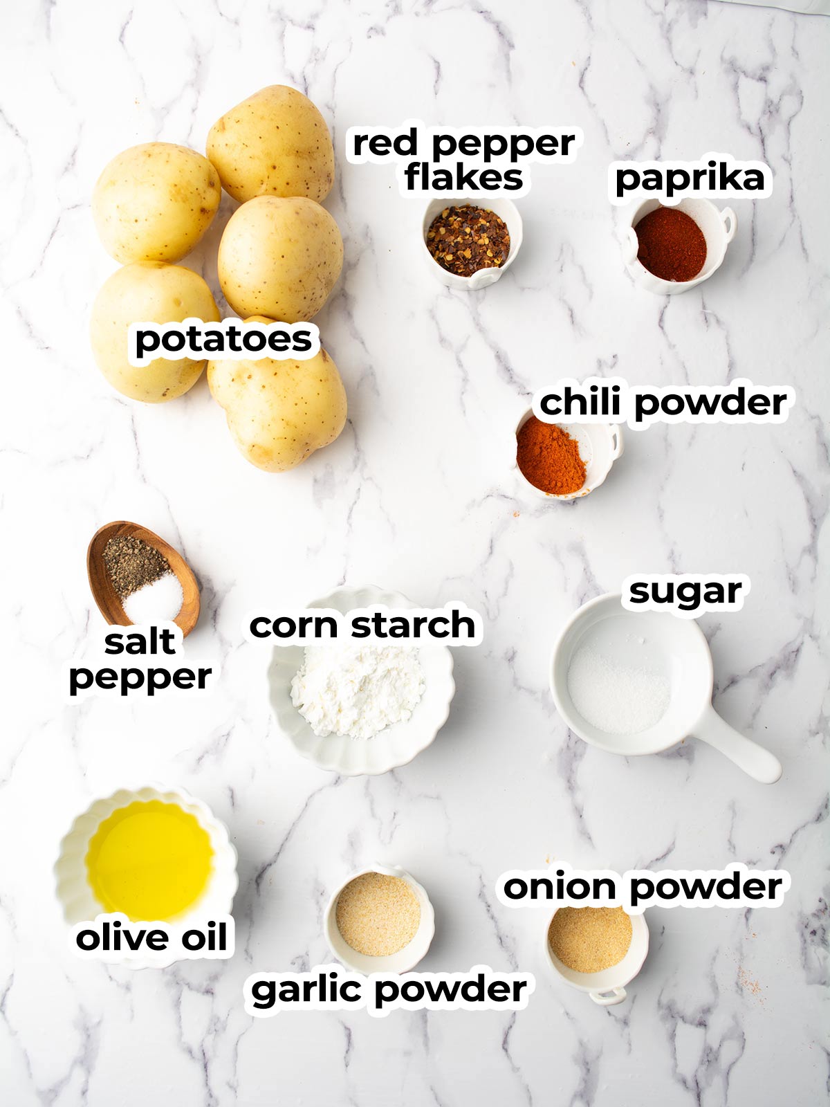 spicy potato wedges ingredients placed in the kitchen counter.