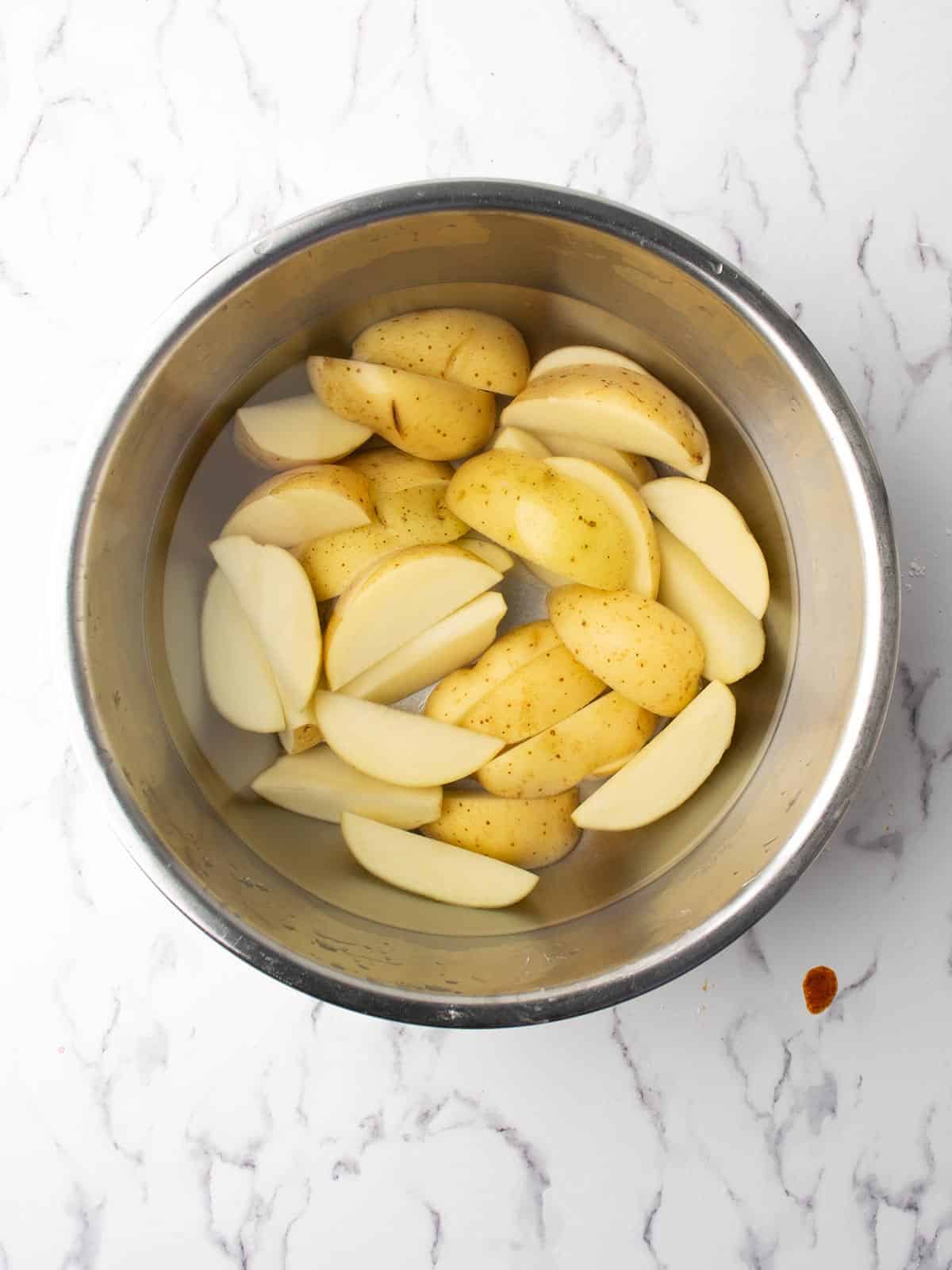 potatoes are soaked in the water.